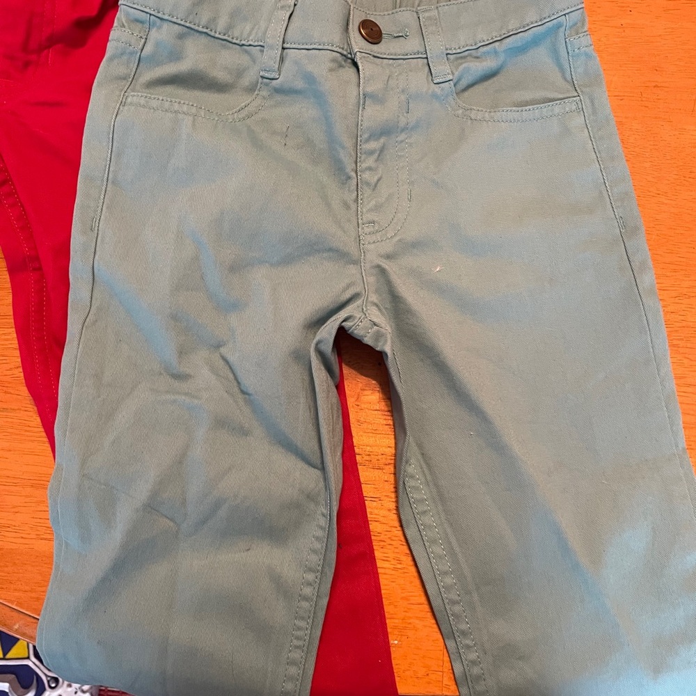 2 pairs Primary Chinos Size 6.  Worn once! EUC!